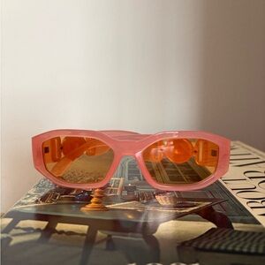 Stylish Pink Sunglasses with Orange Lenses